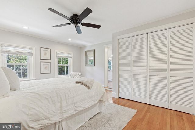a large white bed in a white room