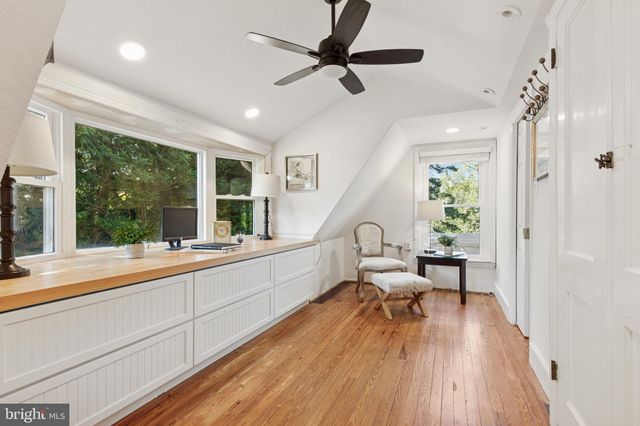 a very nice looking room with wooden floor and a window