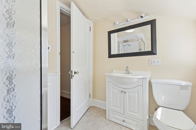 a bathroom with a glass shower door