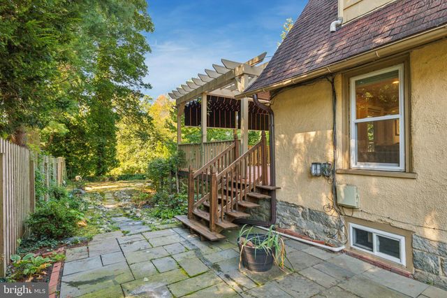 a view of a backyard with a garden and plants