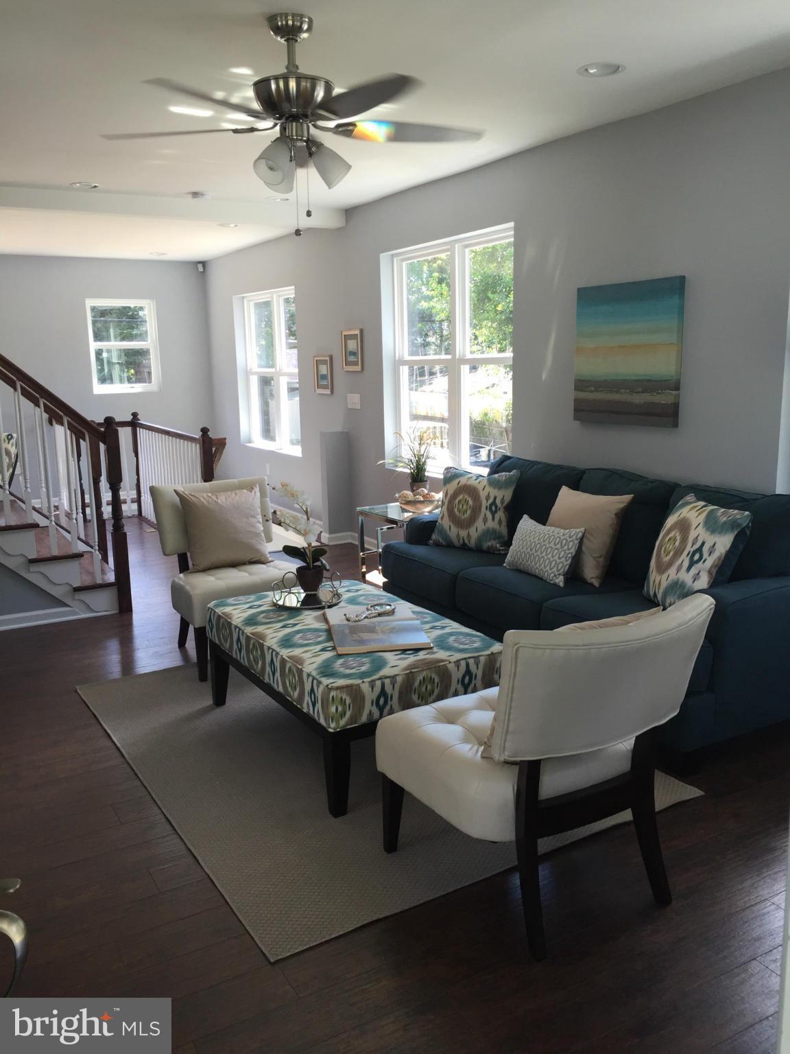 315 East Maple Road Linthicum Heights, MD 21090 - Photo 11 of 30 a living room with furniture a chandelier and a window