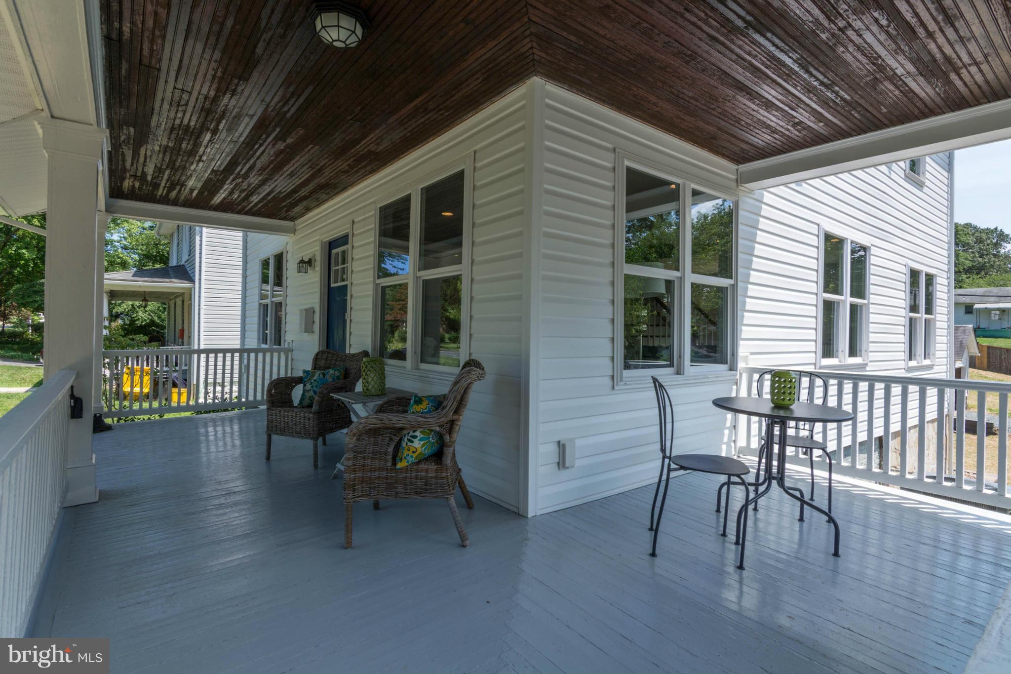 315 East Maple Road Linthicum Heights, MD 21090 - Photo 13 of 30 a view of a patio with table and chairs and wooden floor