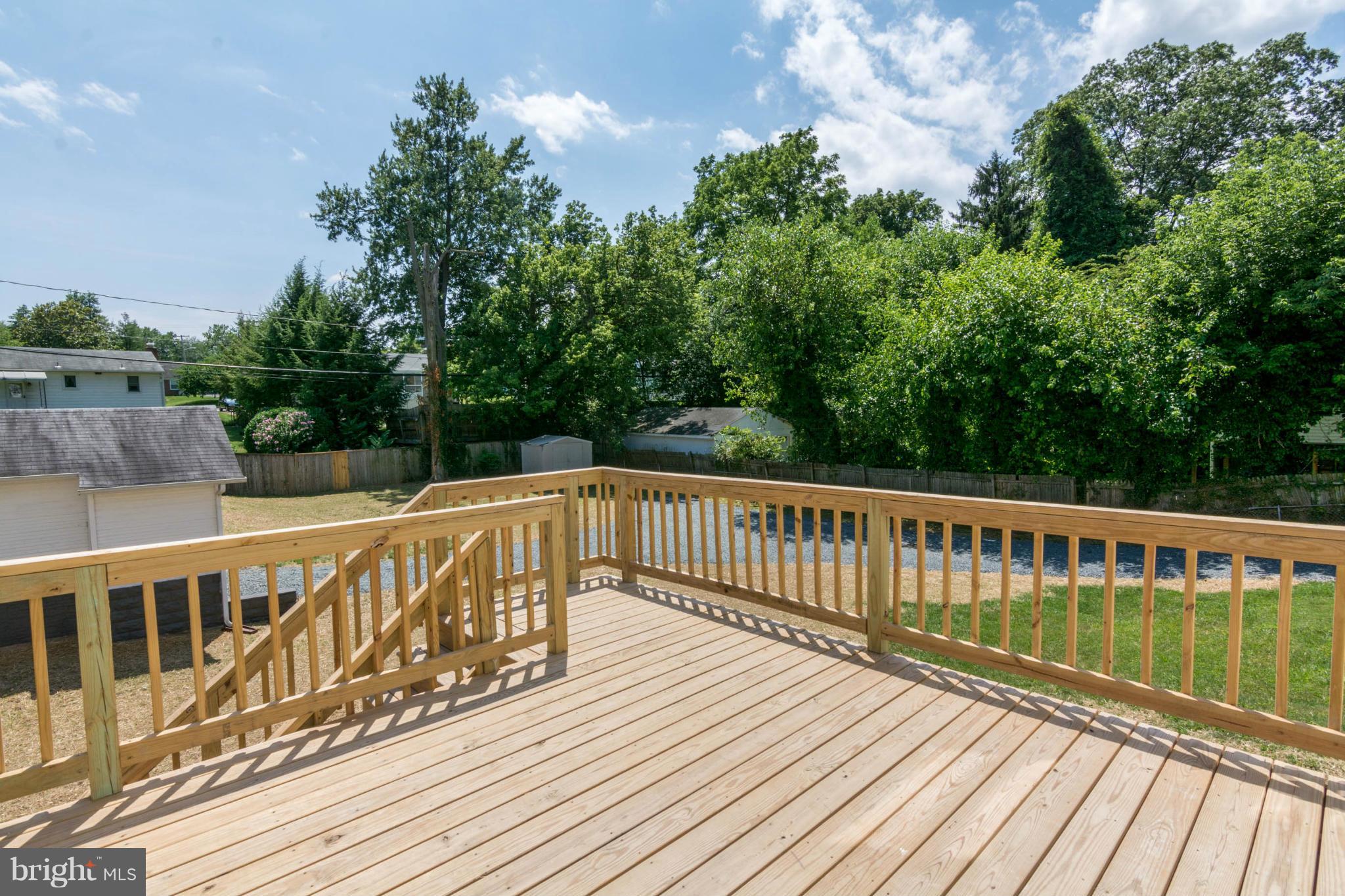 315 East Maple Road Linthicum Heights, MD 21090 - Photo 19 of 30 a view of balcony with wooden floor and fence