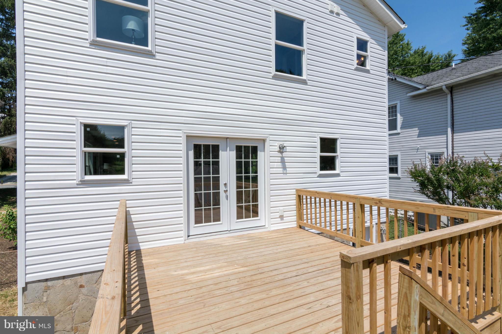 315 East Maple Road Linthicum Heights, MD 21090 - Photo 21 of 30 a view of a house with wooden deck