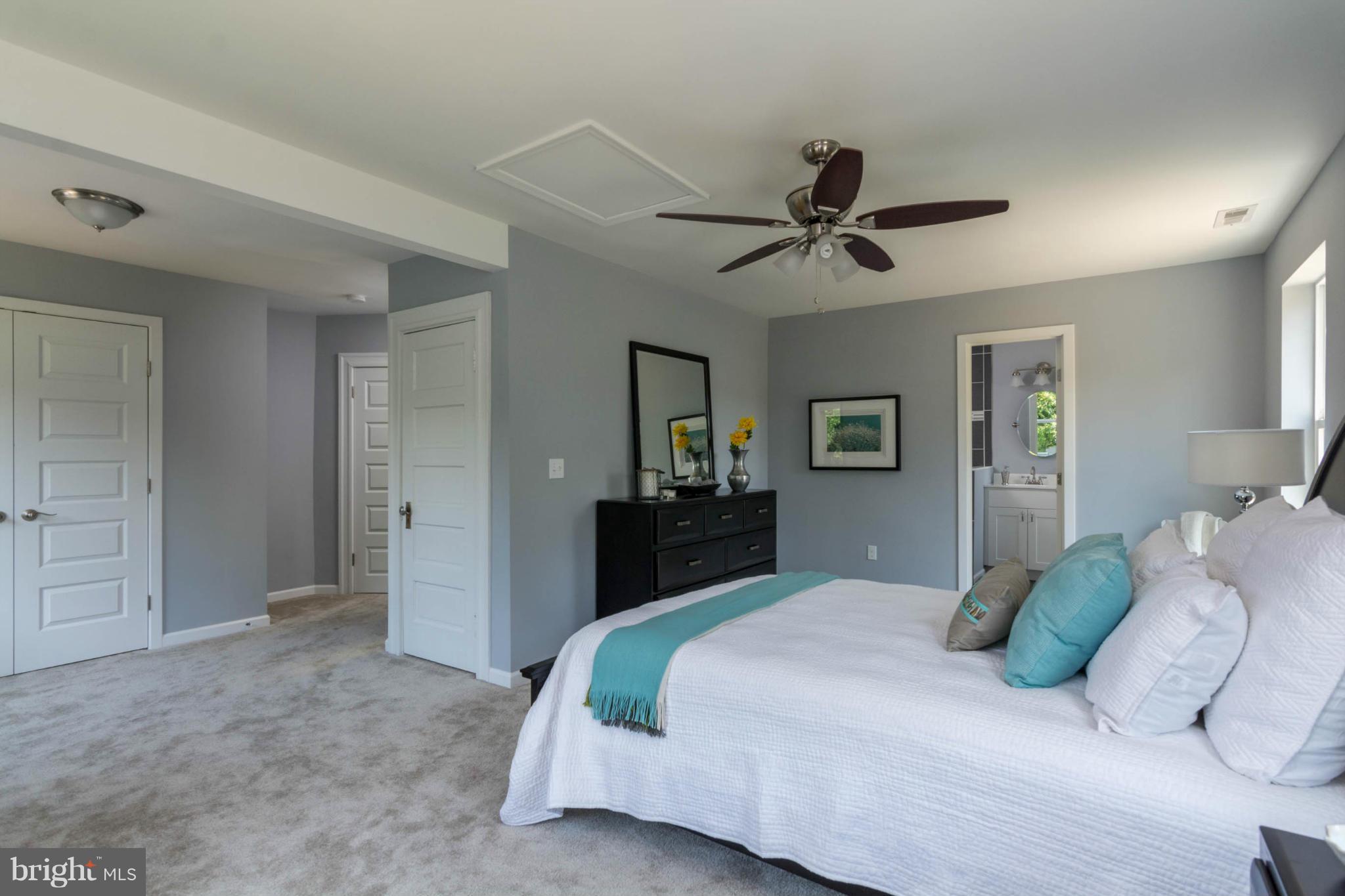315 East Maple Road Linthicum Heights, MD 21090 - Photo 23 of 30 a bedroom with a bed and a chandelier