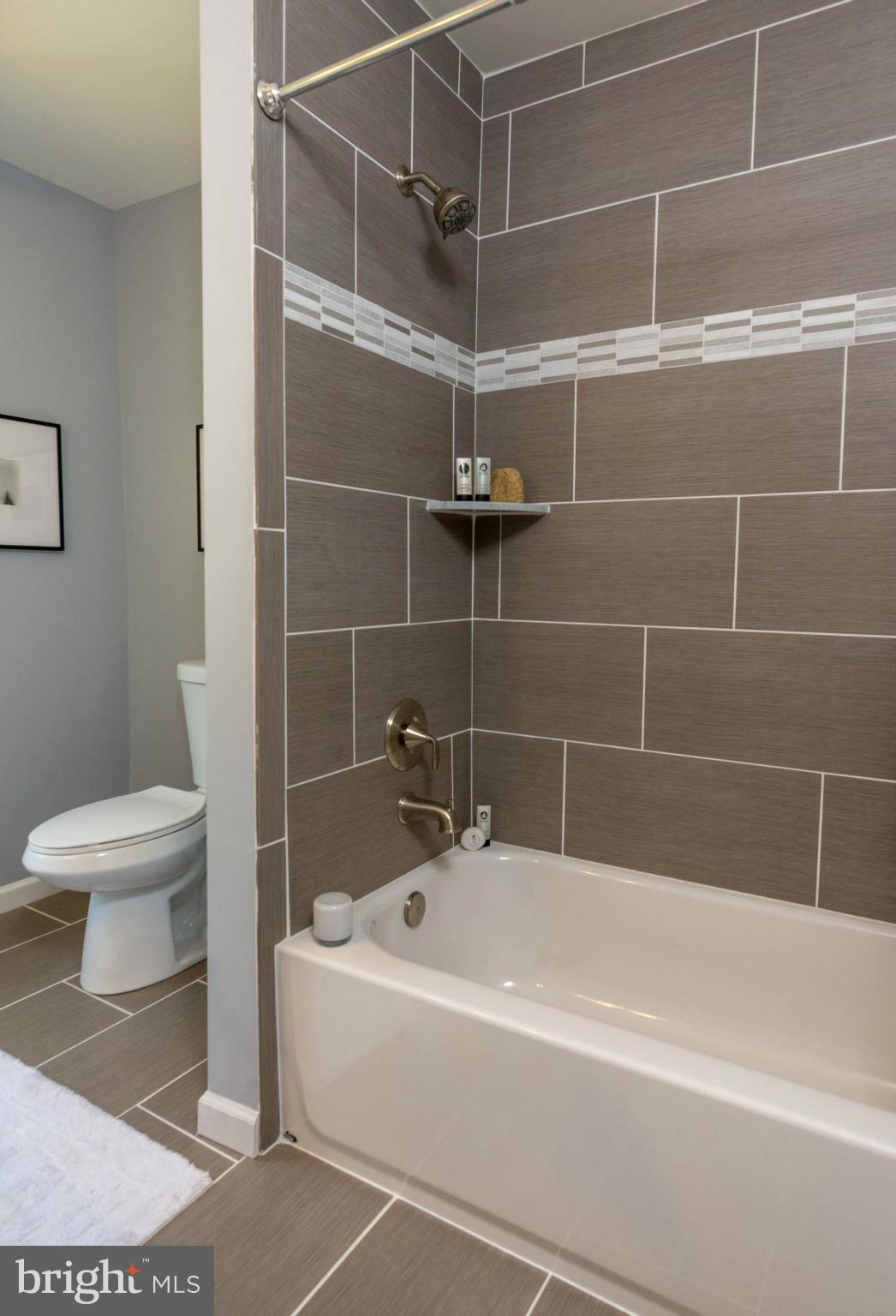 315 East Maple Road Linthicum Heights, MD 21090 - Photo 28 of 30 a bathroom with a bathtub and a toilet