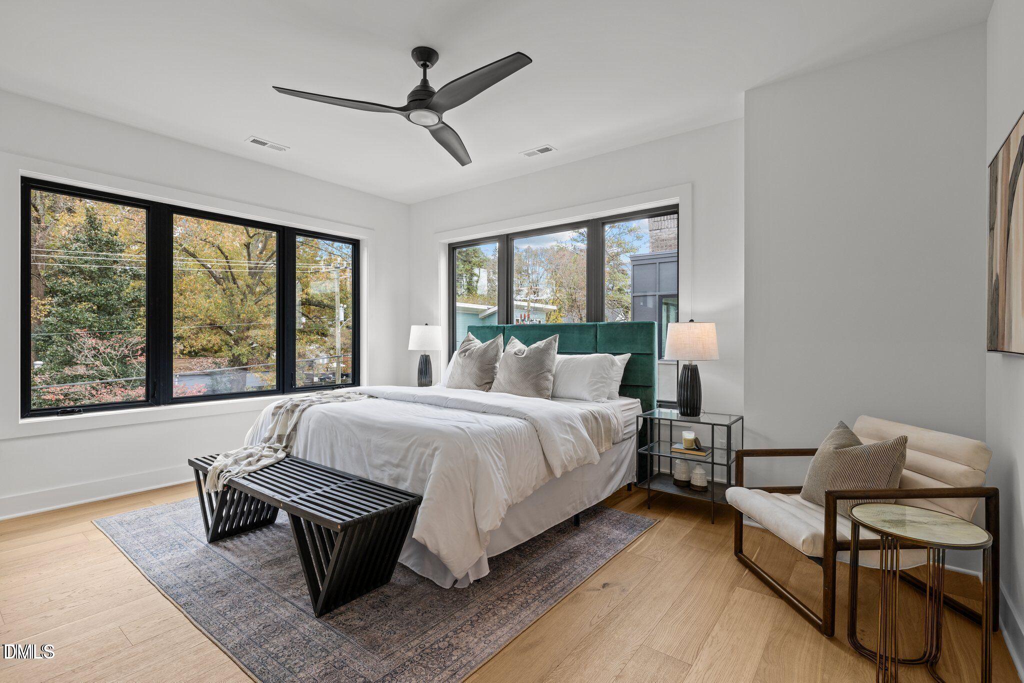 516 Edgecreek Court Raleigh, NC 27604 - Photo 17 of 26 a bed room with a bed and a chair