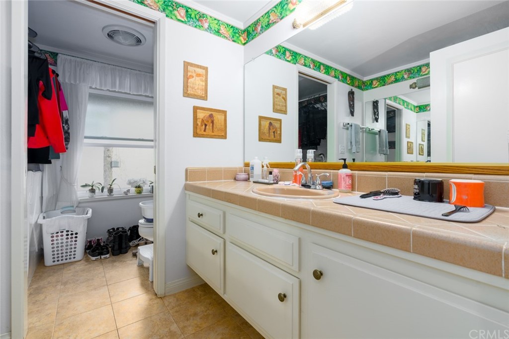 53 Goleta Point Drive Corona del Mar, CA 92625 - Photo 22 of 36 a kitchen with appliances cabinets and a sink