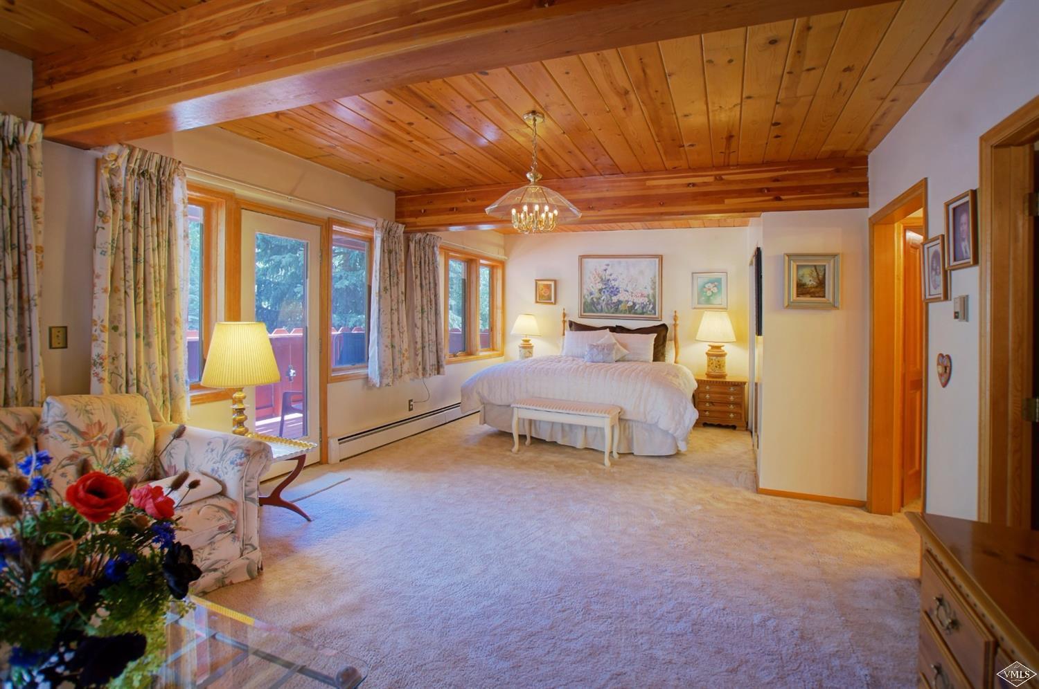 1763 Shasta Place Vail, CO 81657 - Photo 12 of 20 a bedroom with furniture and large windows