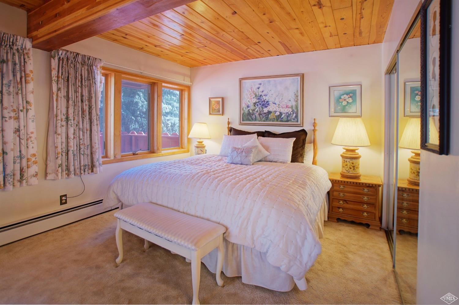 1763 Shasta Place Vail, CO 81657 - Photo 14 of 20 a bedroom with a bed and wooden floor