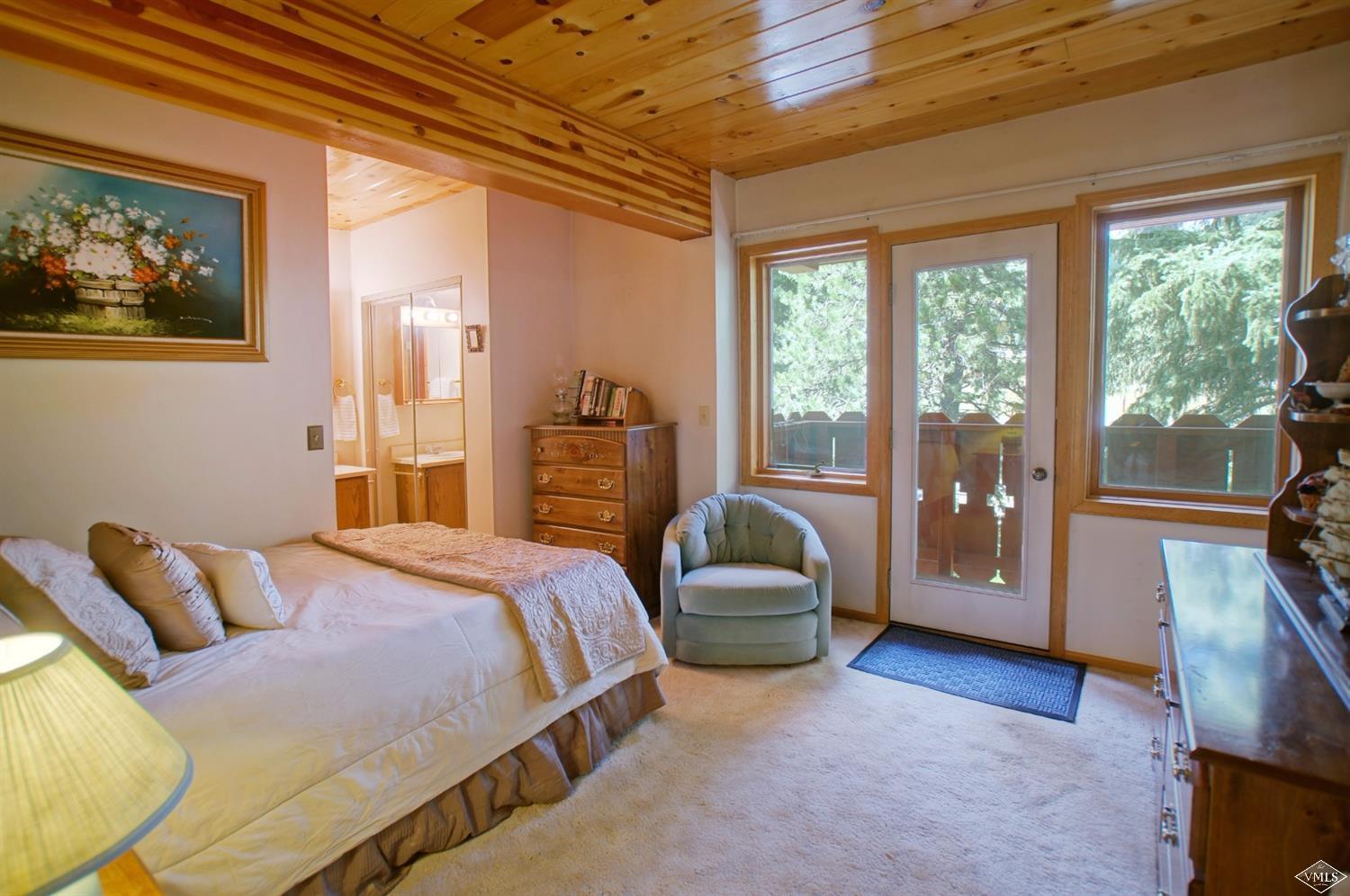 1763 Shasta Place Vail, CO 81657 - Photo 15 of 20 a bedroom with a large bed and a couch