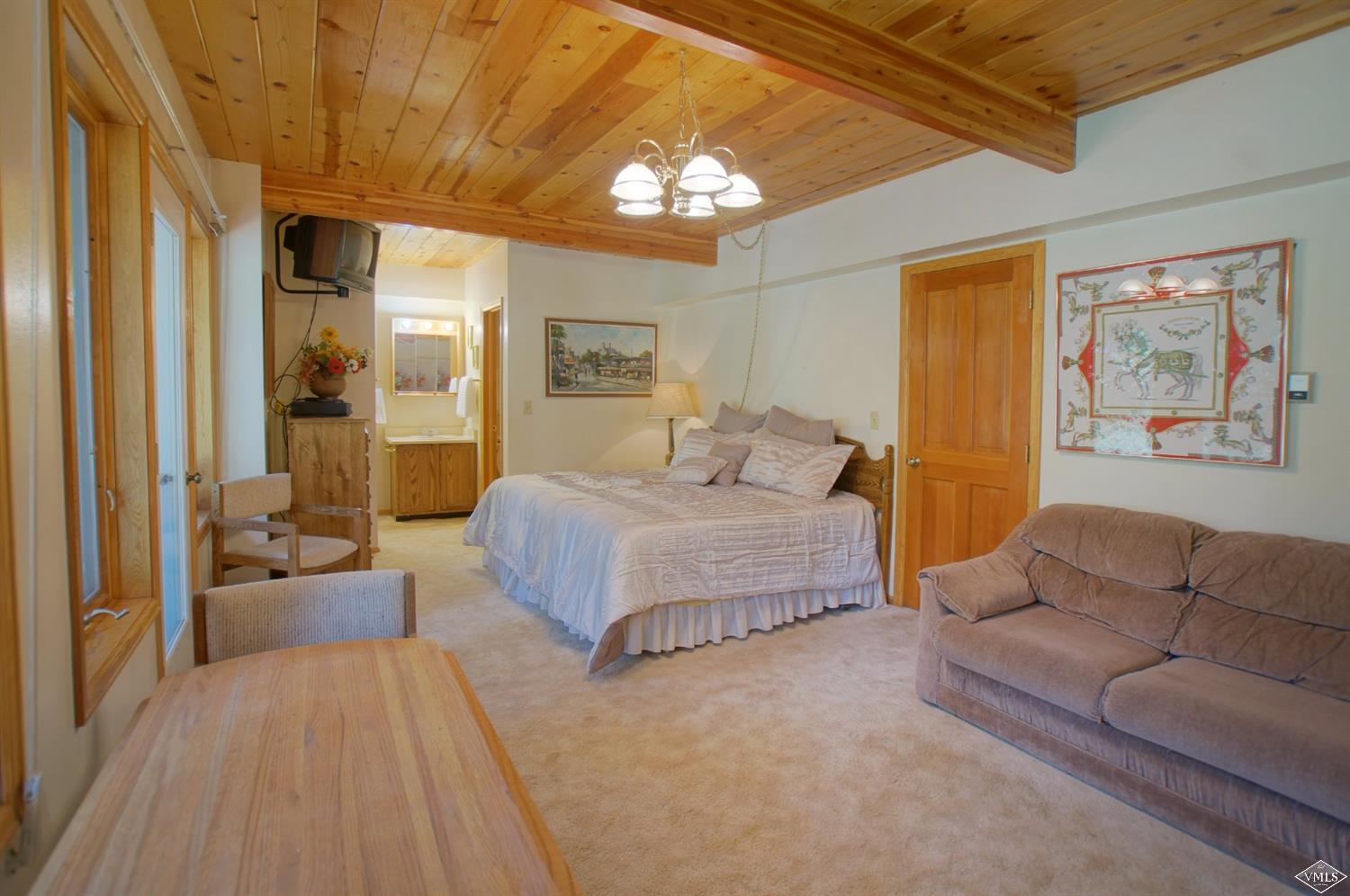 1763 Shasta Place Vail, CO 81657 - Photo 16 of 20 a bedroom with a large bed couch and a window