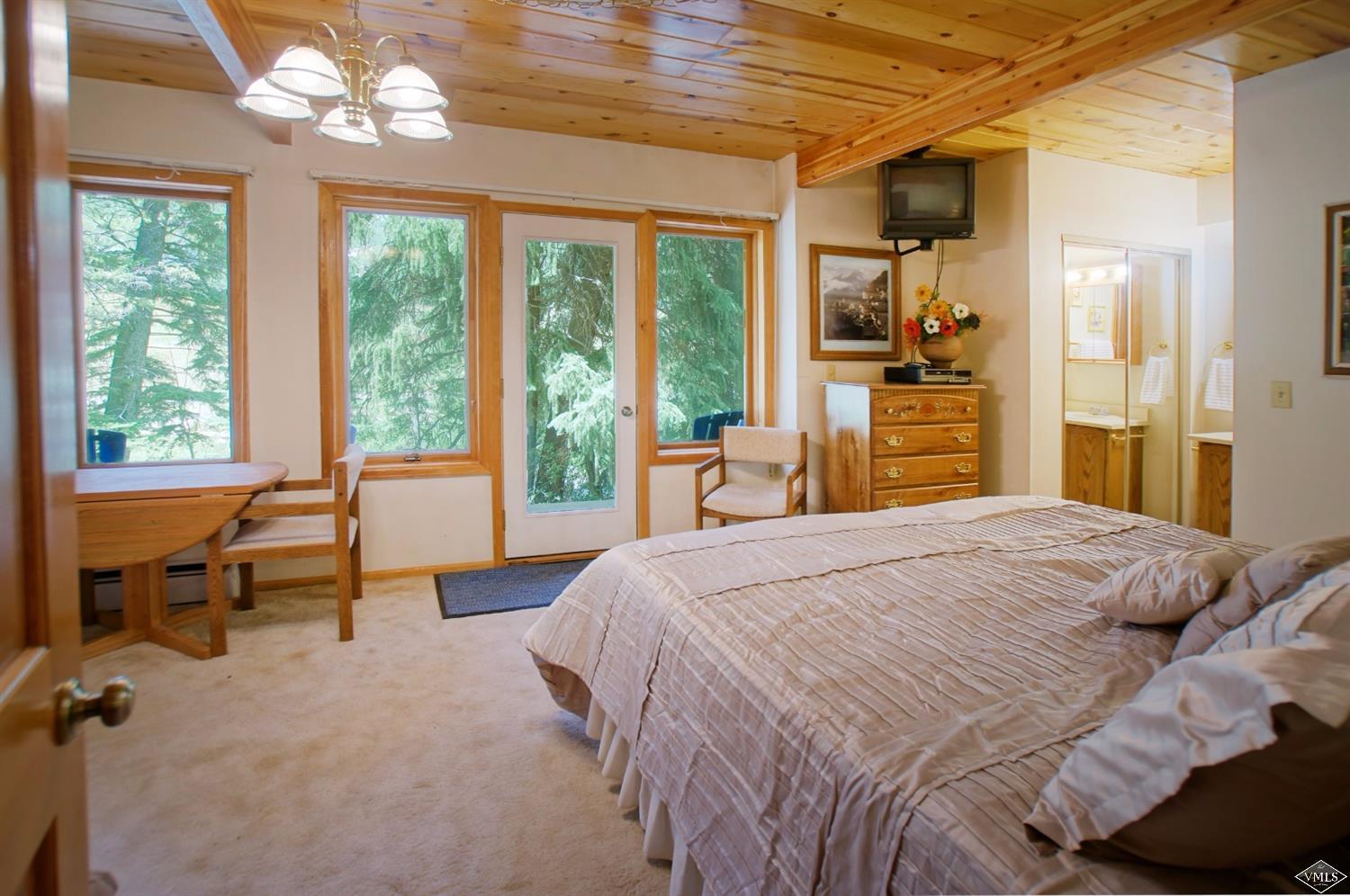 1763 Shasta Place Vail, CO 81657 - Photo 17 of 20 a bedroom with a bed and a large window