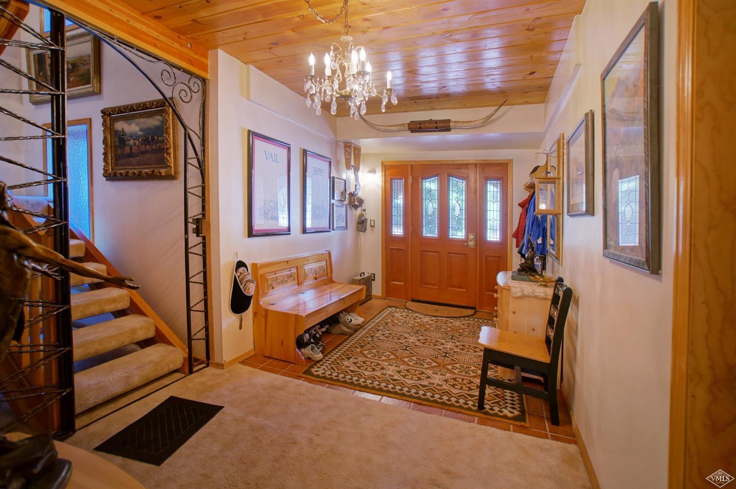 1763 Shasta Place Vail, CO 81657 - Photo 5 of 20 a view of living room with furniture and a chandelier