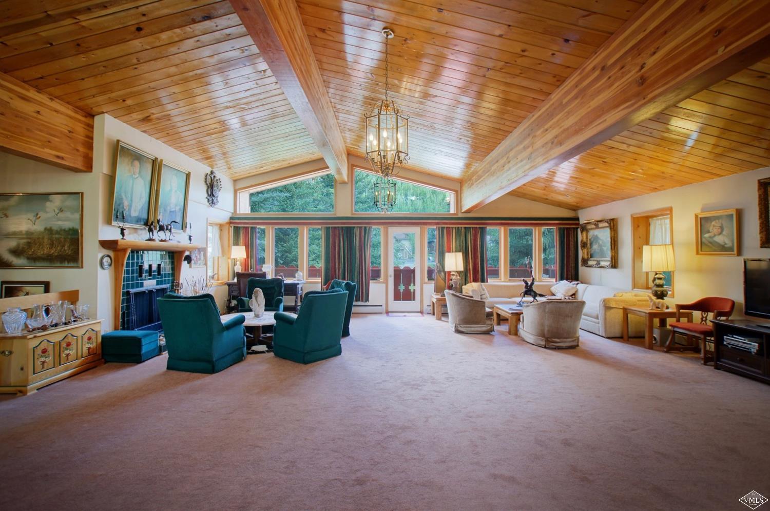 1763 Shasta Place Vail, CO 81657 - Photo 6 of 20 a living room with furniture and a chandelier