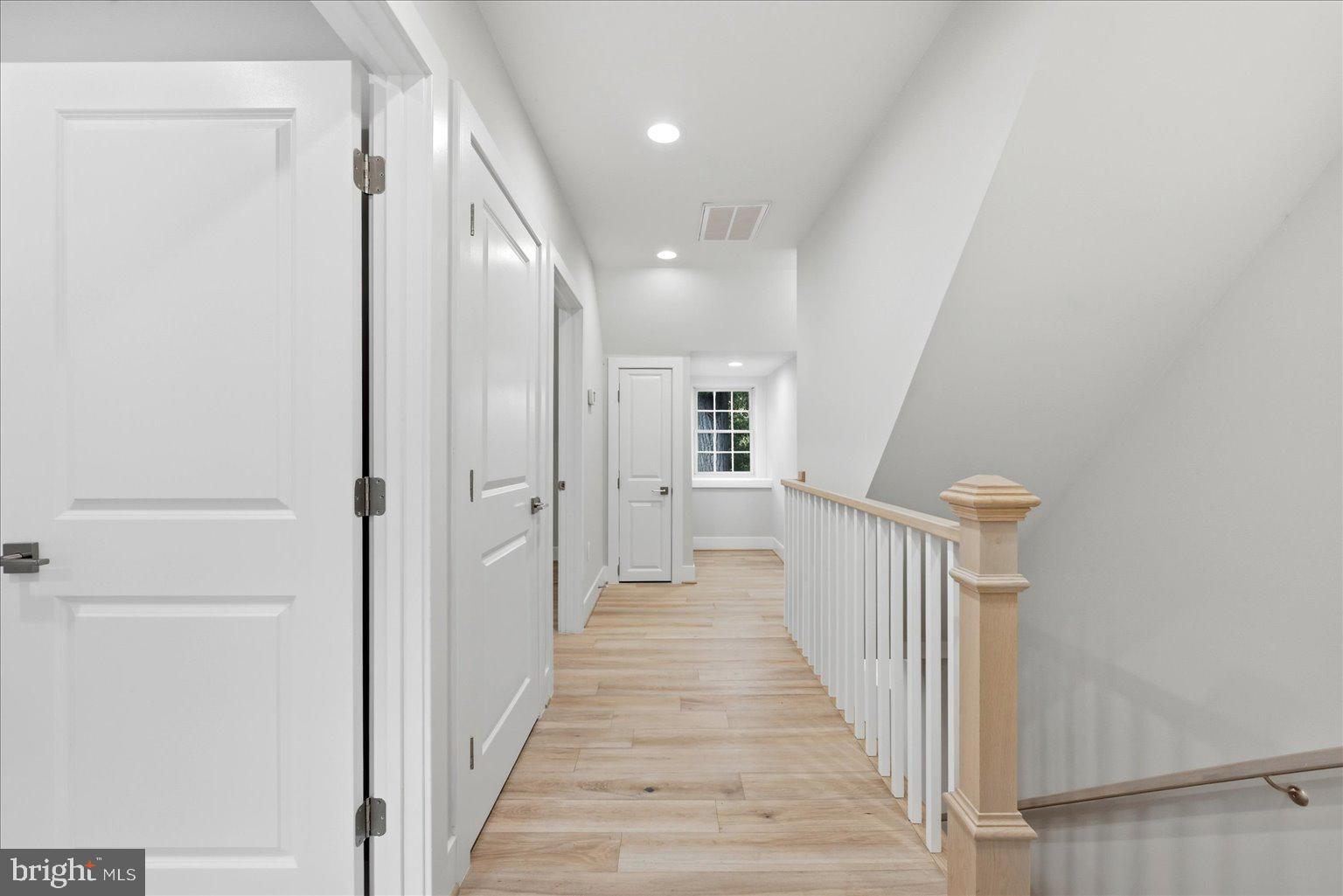 3517 Rodman Street Northwest Washington, DC 20008 - Photo 32 of 57 a view of a hallway with wooden floor and entryway