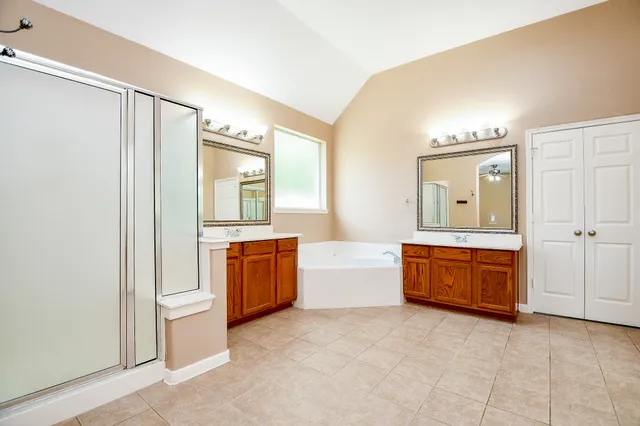 a view of a room with wooden floor and cabinet