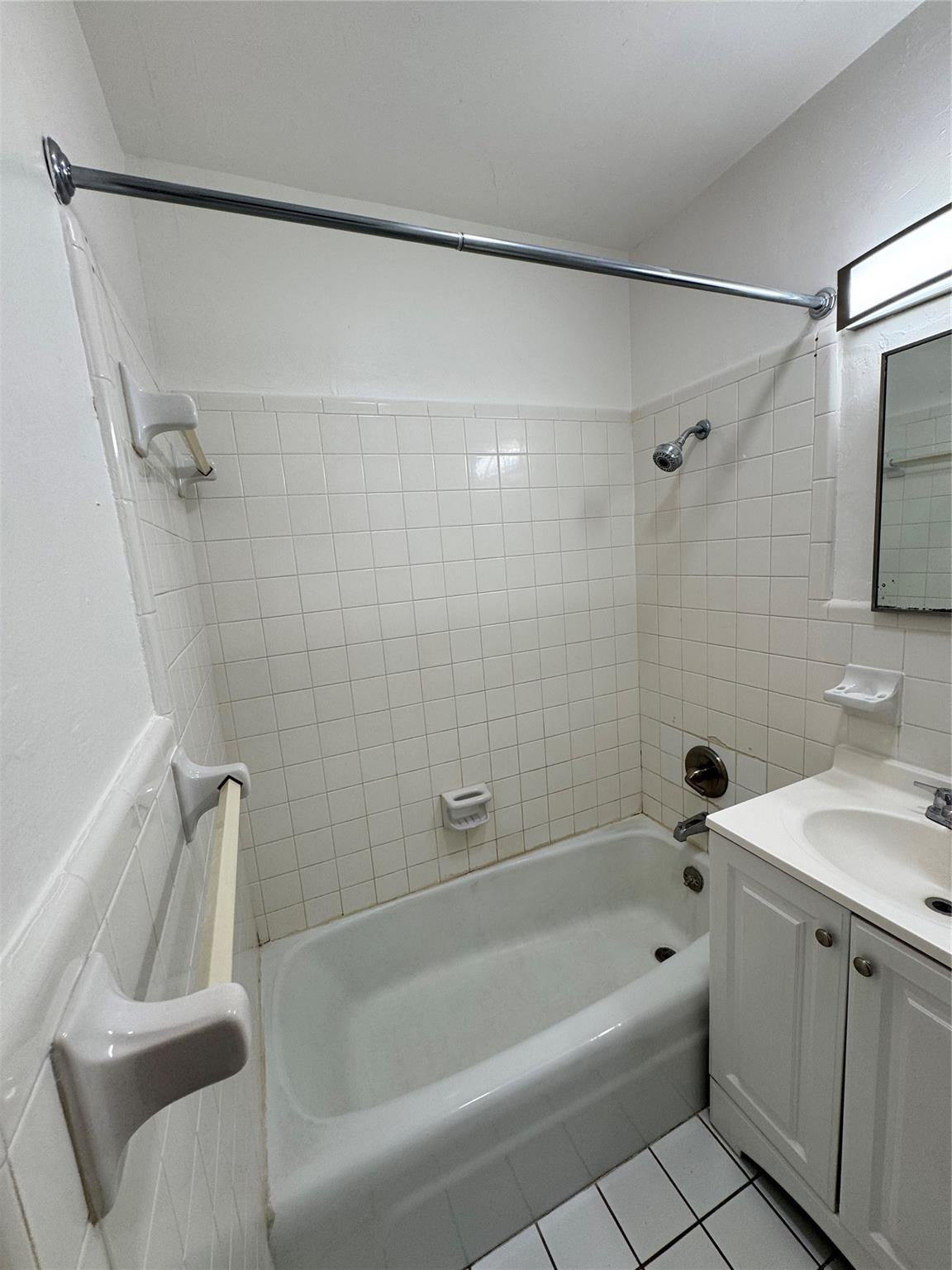 500 Nathan Hale Road, Unit 1 West Palm Beach, FL 33405 - Photo 8 of 8 a bathroom with a tub a sink and a shower