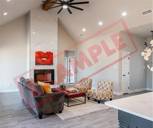 a living room with furniture kitchen view and a fireplace