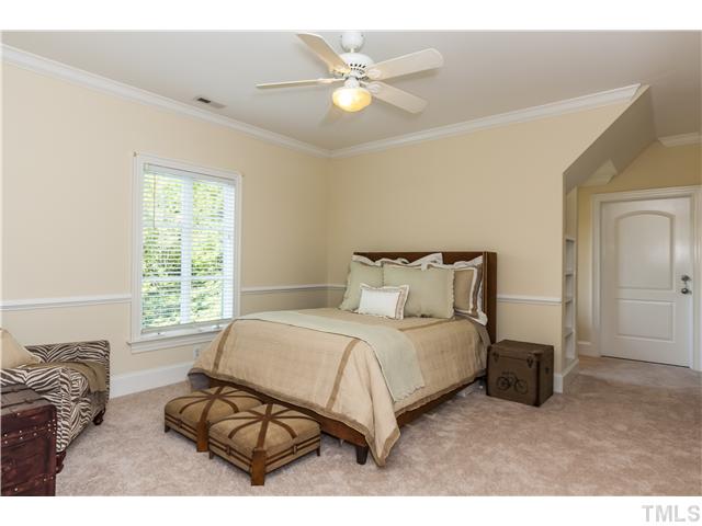 1913 Chase Court Raleigh, NC 27607 - Photo 13 of 25 Secondary bedrooms are spacious, and this one has a "secret" room behind the door shown on the right side of the frame.