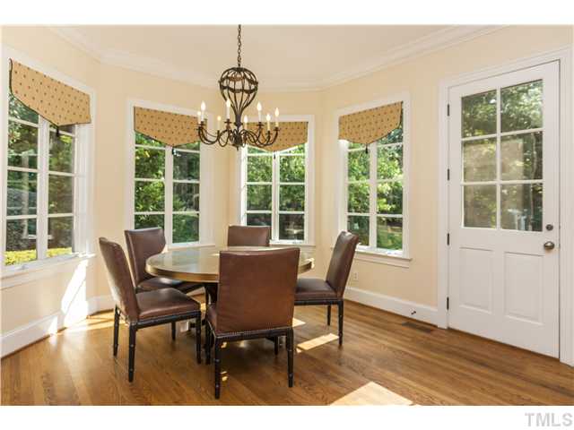 1913 Chase Court Raleigh, NC 27607 - Photo 6 of 25 Sunny breakfast room is a nice transition space from the kitchen to the garage, and outside into the back yard...
