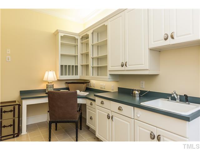 1913 Chase Court Raleigh, NC 27607 - Photo 7 of 25 The laundry room has a terrific work area, lots of cabinet space, and a laundry chute from the second floor...