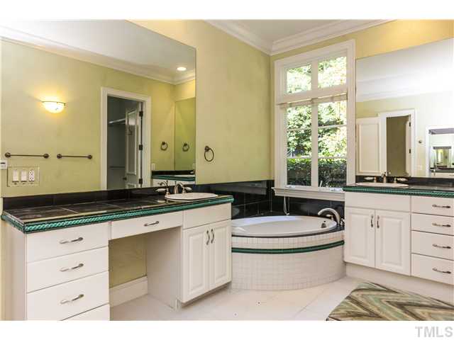 1913 Chase Court Raleigh, NC 27607 - Photo 9 of 25 Master bath has his-and-hers closets with infrared light sensors, double vanities, deep soaking tub and a separate shower (not shown).