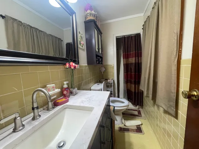 a kitchen with a sink and a refrigerator