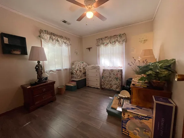 a livingroom with window and furniture