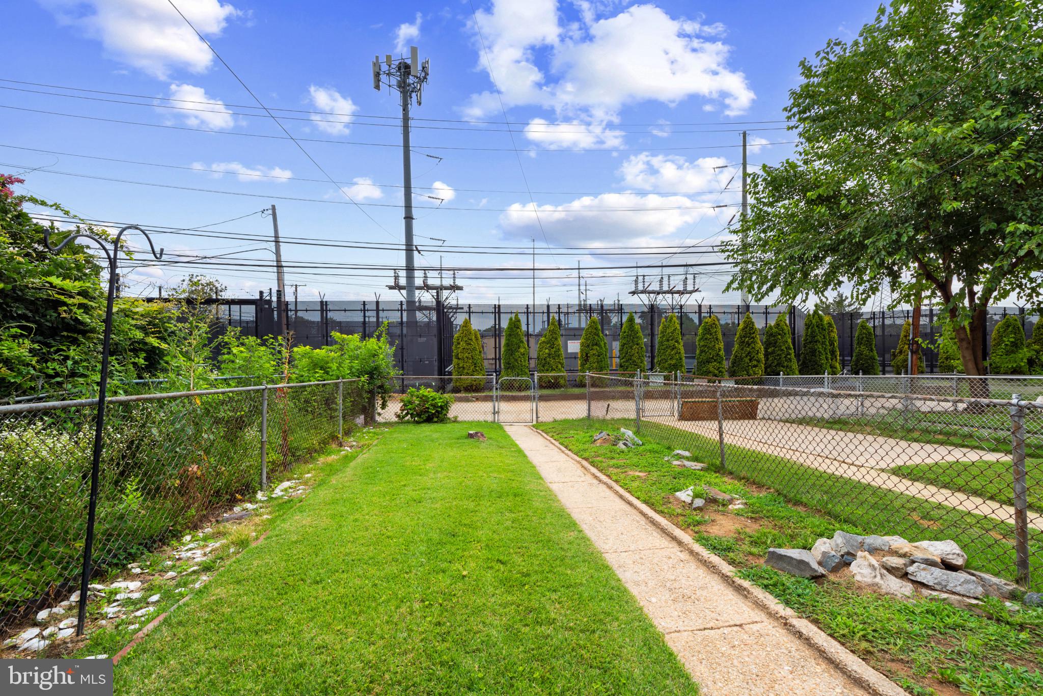 2207 Hawthorne Road Baltimore, MD 21220 - Photo 33 of 39 a view of a swimming pool with a garden