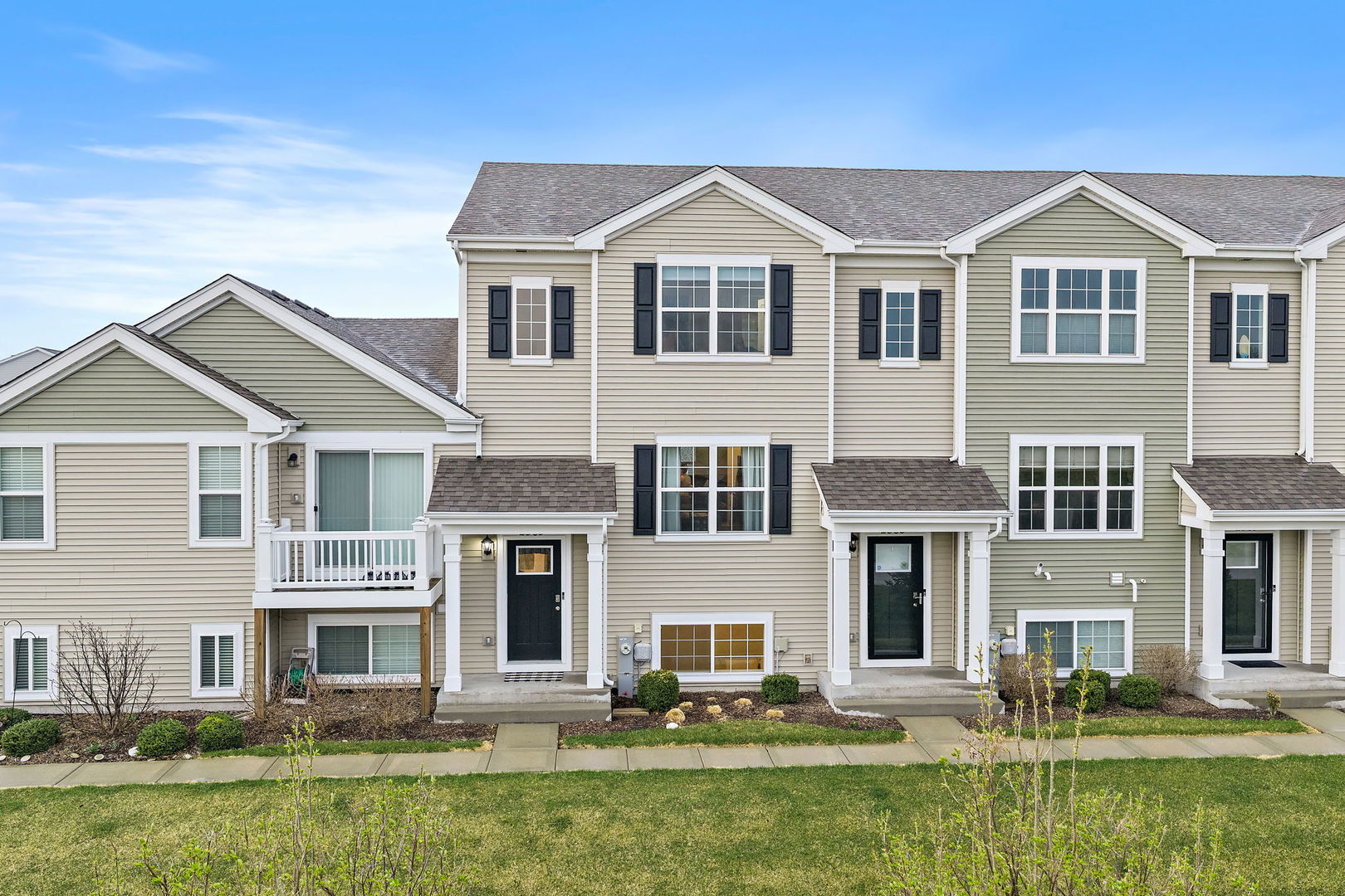 2563 BELLA Drive Pingree Grove, IL 60140 - Photo 1 of 38 a front view of a house with a yard