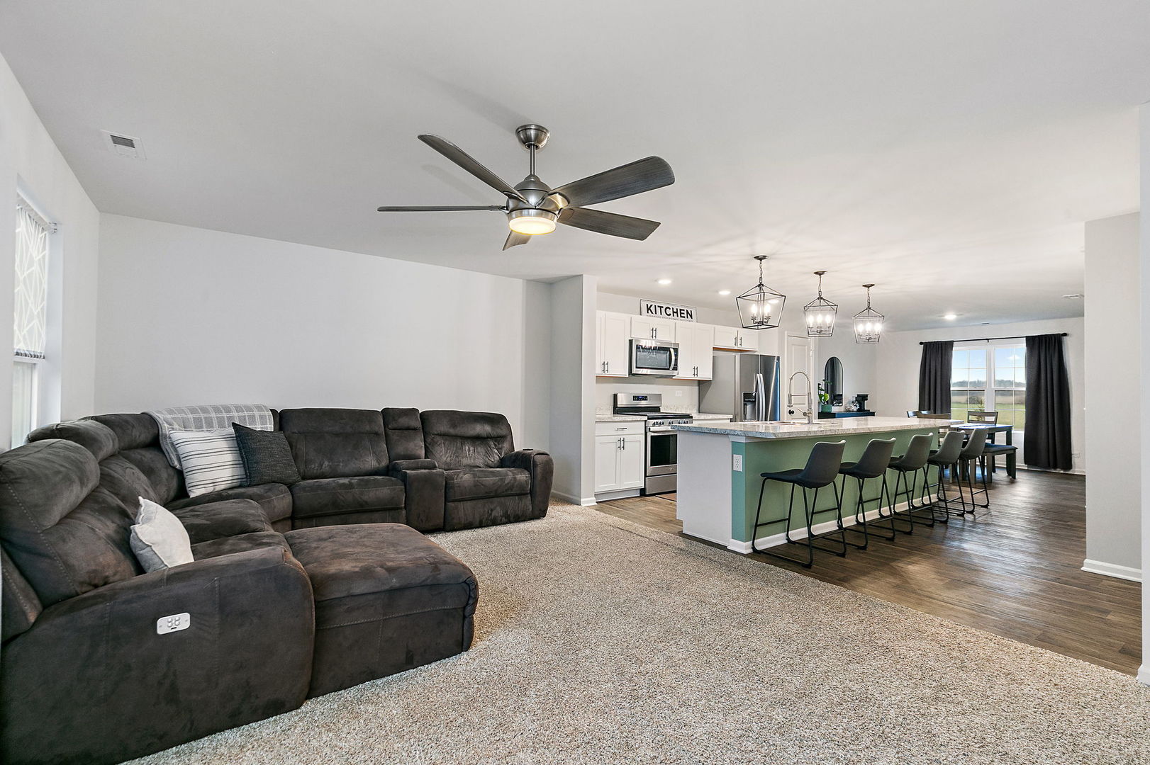 2563 BELLA Drive Pingree Grove, IL 60140 - Photo 11 of 38 a living room with furniture and kitchen view