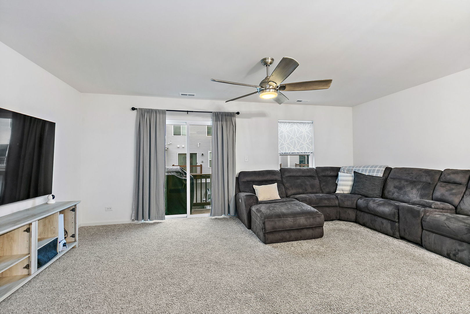 2563 BELLA Drive Pingree Grove, IL 60140 - Photo 12 of 38 a living room with furniture and a flat screen tv