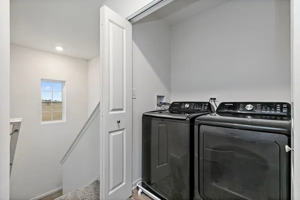 a utility room with washer and dryer