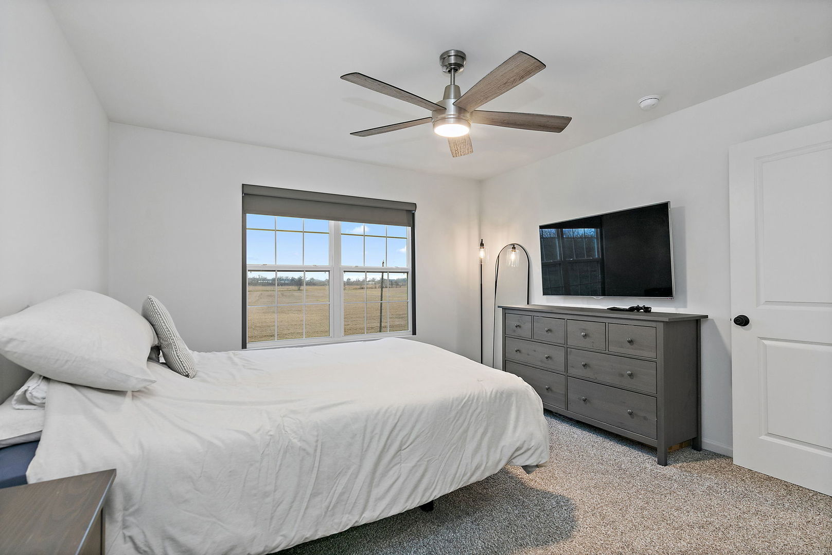2563 BELLA Drive Pingree Grove, IL 60140 - Photo 17 of 38 a bedroom with a bed and a flat screen tv