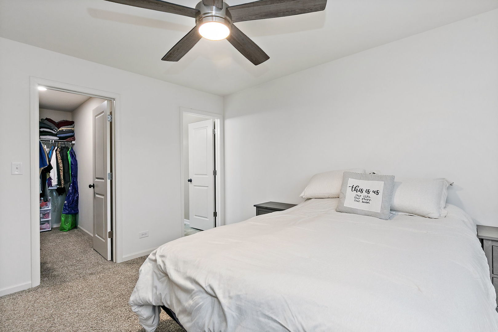 2563 BELLA Drive Pingree Grove, IL 60140 - Photo 18 of 38 a bedroom with a bed and a chandelier