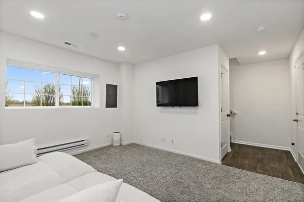 a living room with a couch and a flat screen tv