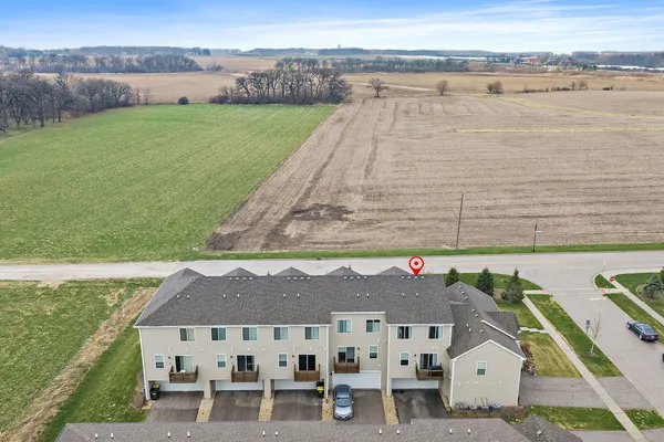 an aerial view of a house with outdoor space and lake view