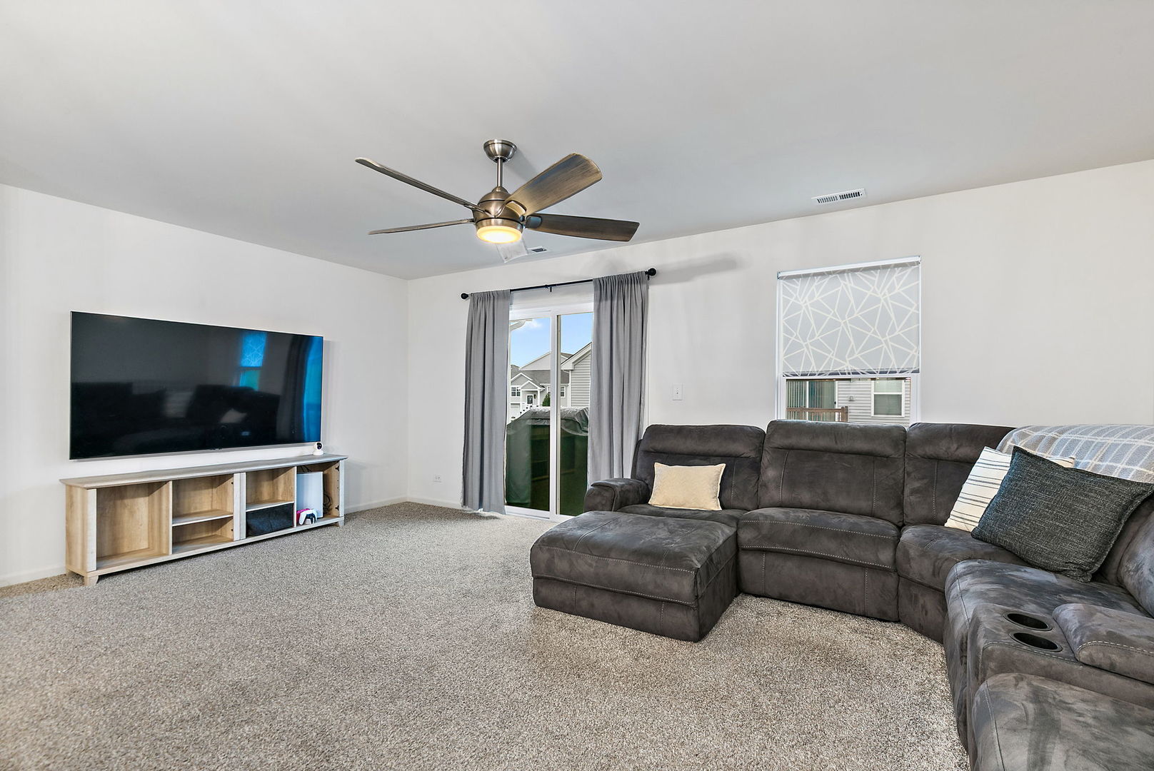 2563 BELLA Drive Pingree Grove, IL 60140 - Photo 10 of 38 a living room with furniture and a flat screen tv