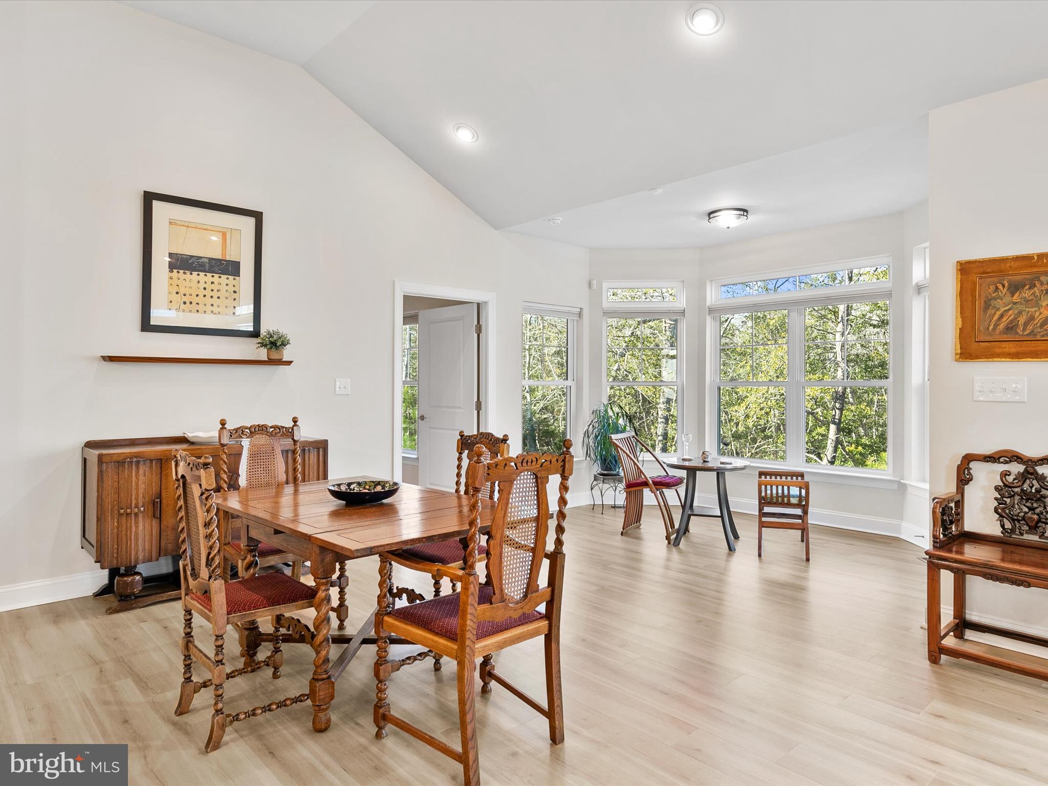 22657 Deep Woods Road Milton, DE 19968 - Photo 11 of 51 a dining room with furniture window and wooden floor