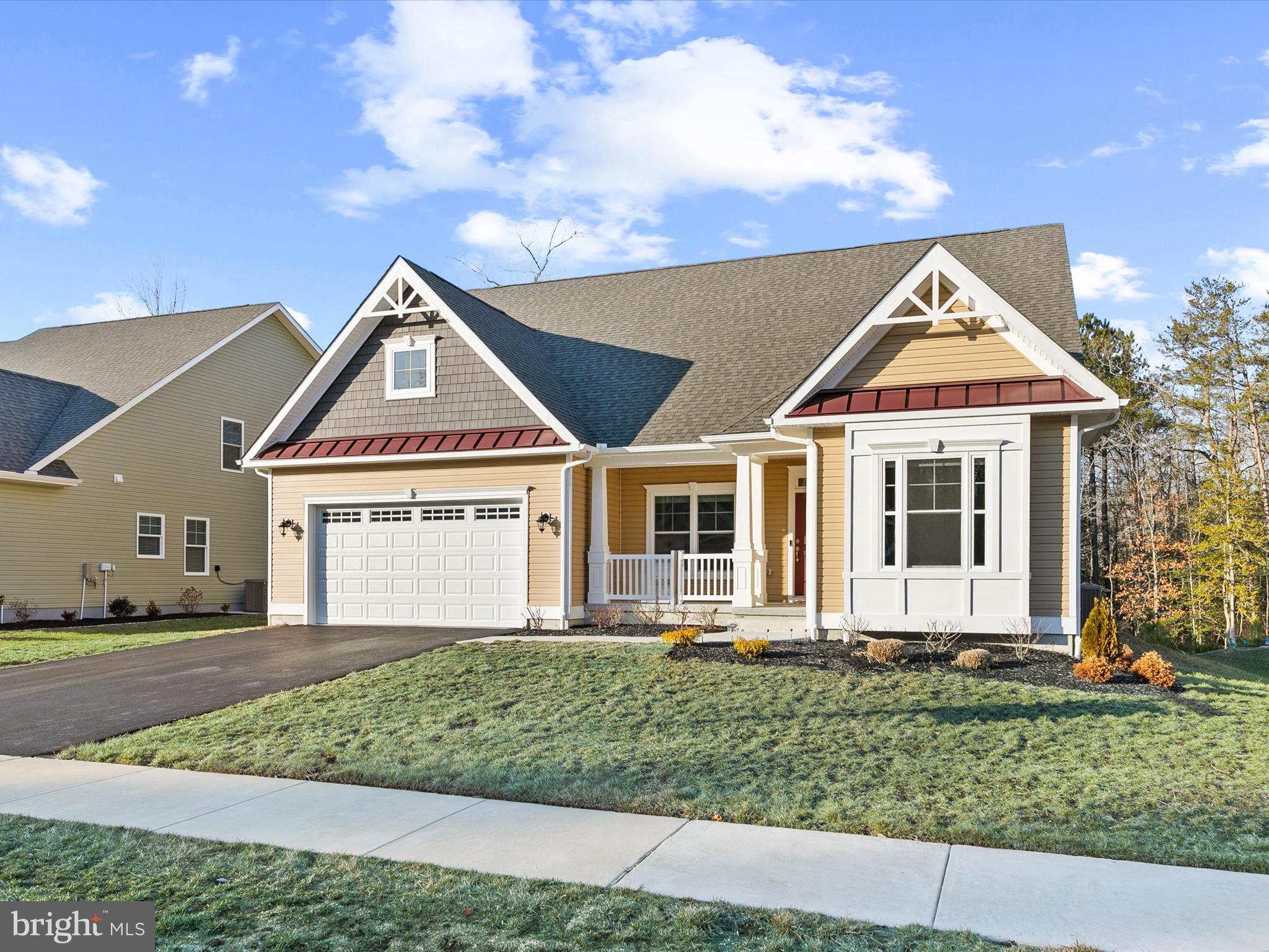 22657 Deep Woods Road Milton, DE 19968 - Photo 2 of 51 a front view of a house with a yard