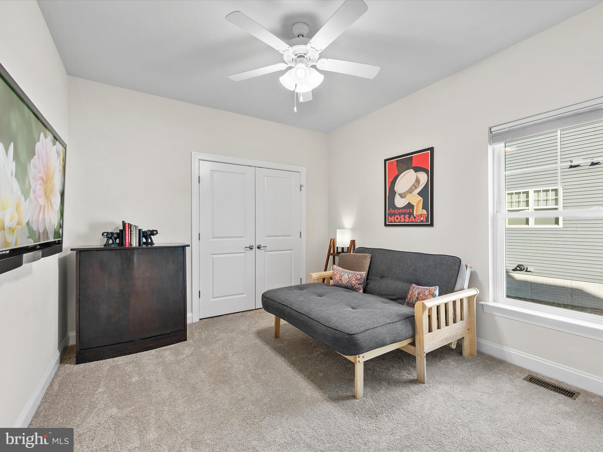 22657 Deep Woods Road Milton, DE 19968 - Photo 25 of 51 a living room with furniture and a flat screen tv