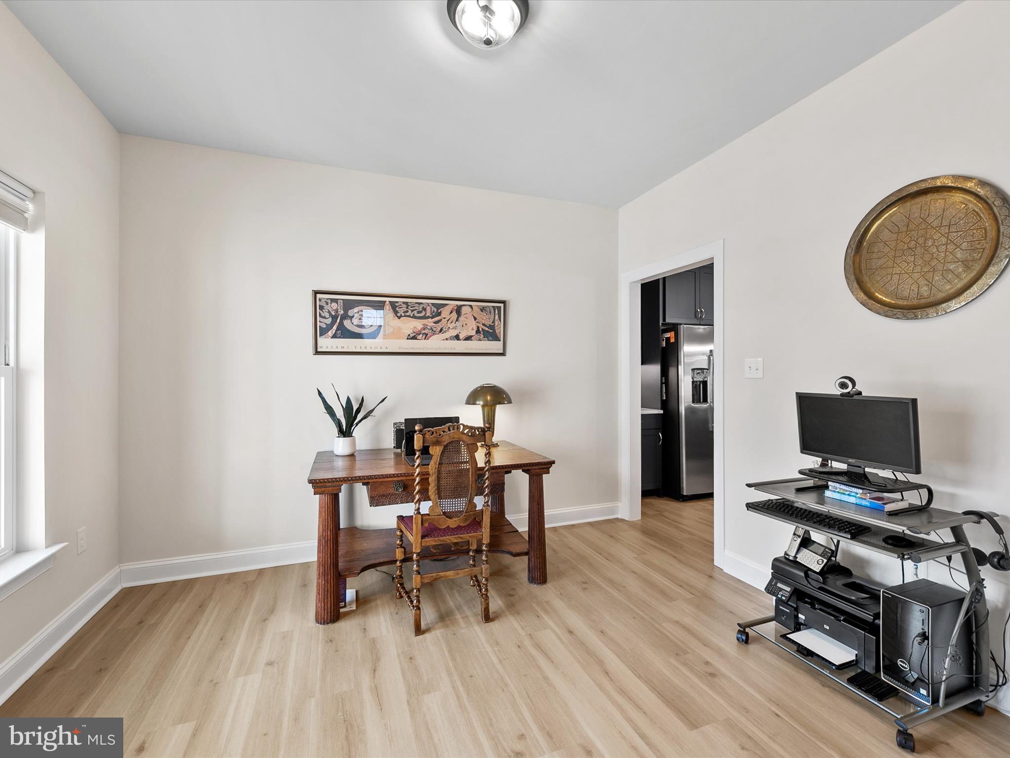 22657 Deep Woods Road Milton, DE 19968 - Photo 29 of 51 a view of a workspace with furniture and a window