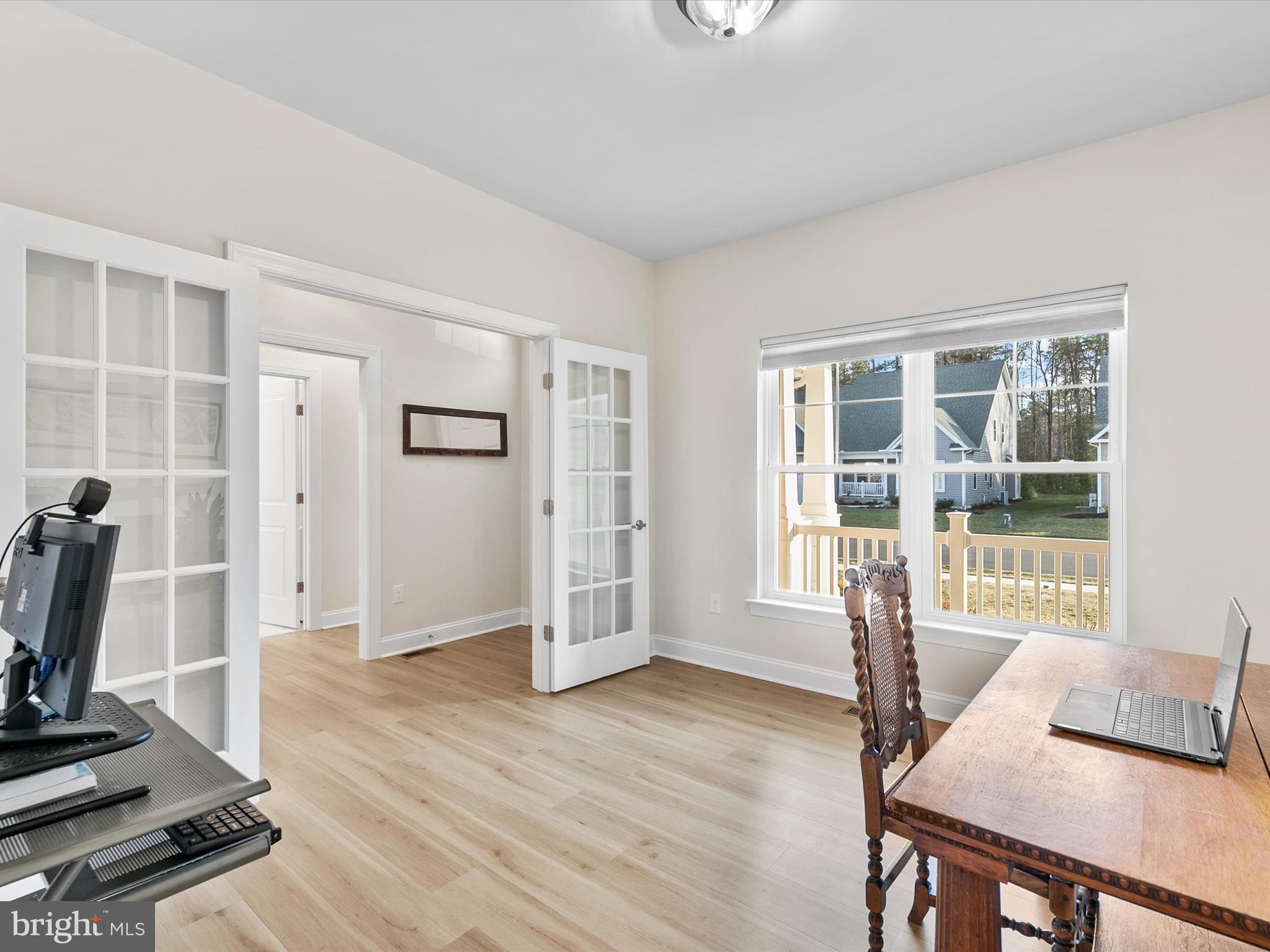 22657 Deep Woods Road Milton, DE 19968 - Photo 30 of 51 a view of a livingroom with a furniture and floor to ceiling window