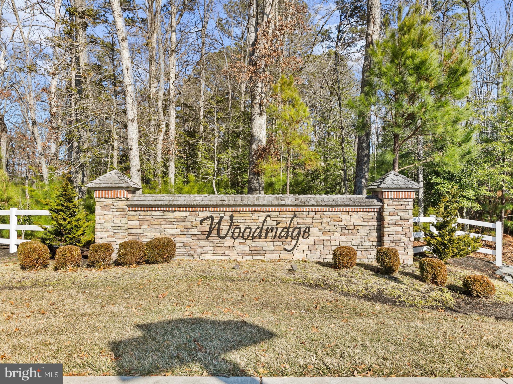 22657 Deep Woods Road Milton, DE 19968 - Photo 35 of 51 a street sign on a wall next to a road
