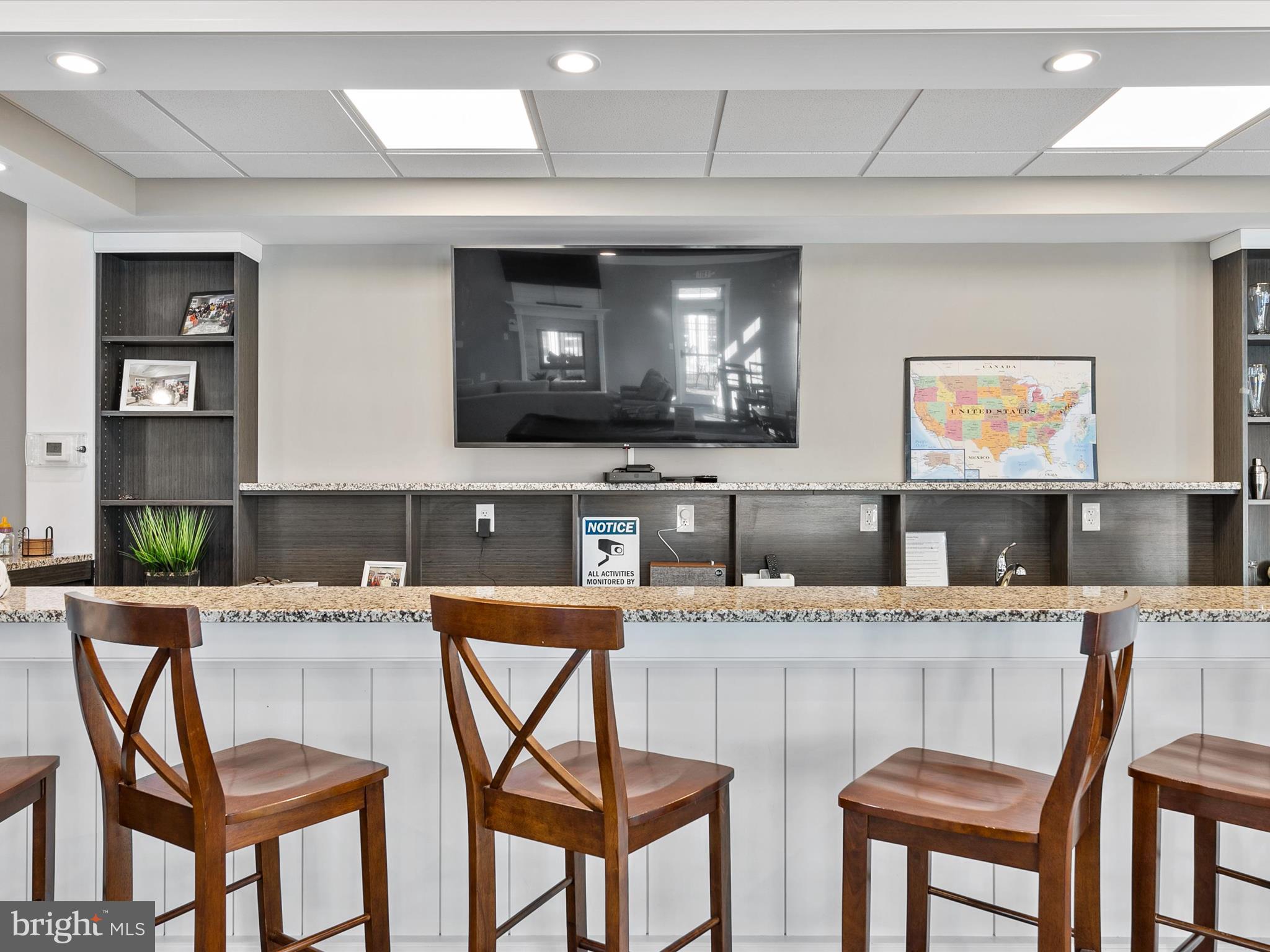 22657 Deep Woods Road Milton, DE 19968 - Photo 40 of 51 a kitchen with a table chairs sink and cabinets
