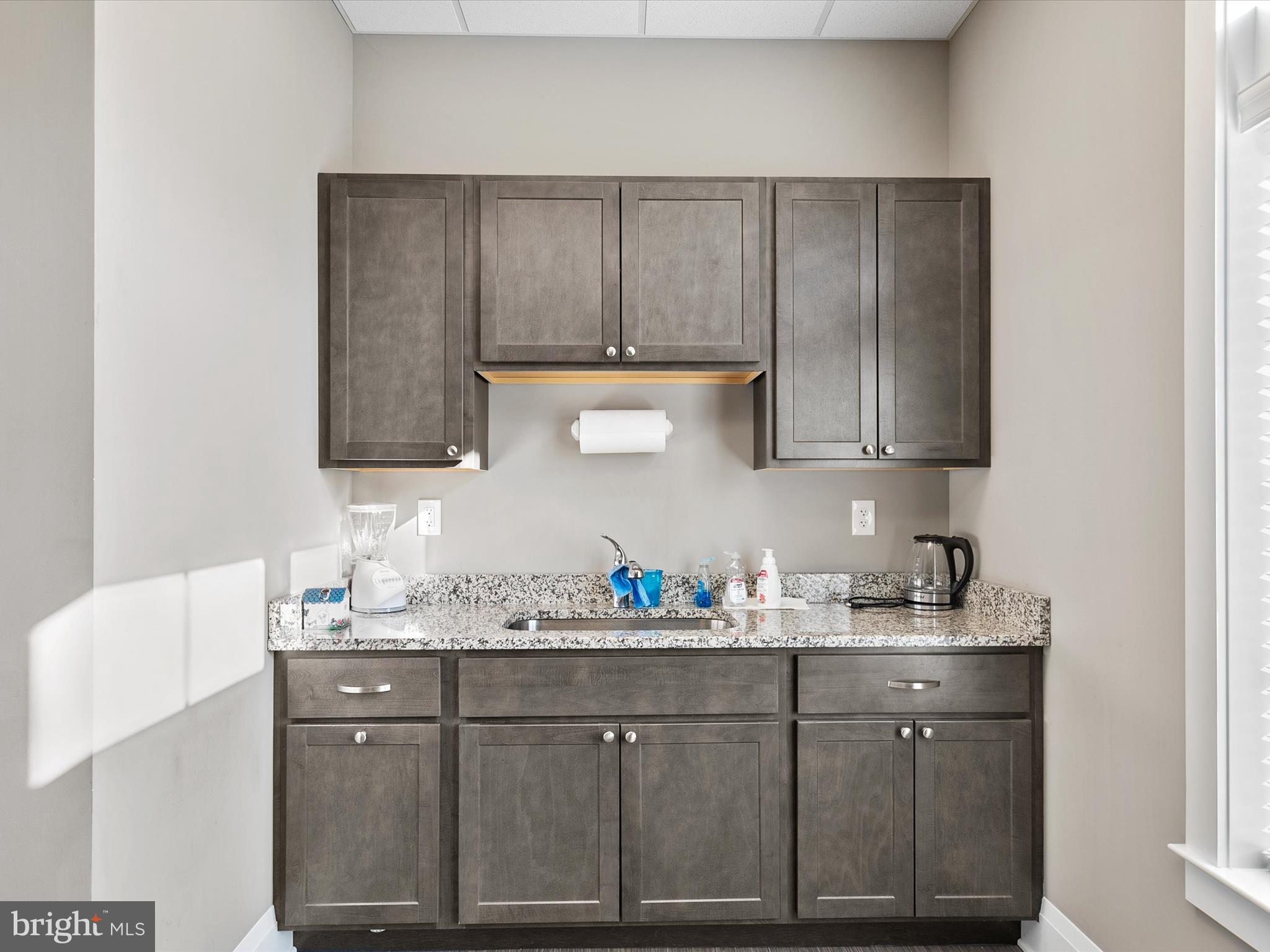 22657 Deep Woods Road Milton, DE 19968 - Photo 41 of 51 a kitchen with a sink cabinets and wooden floor
