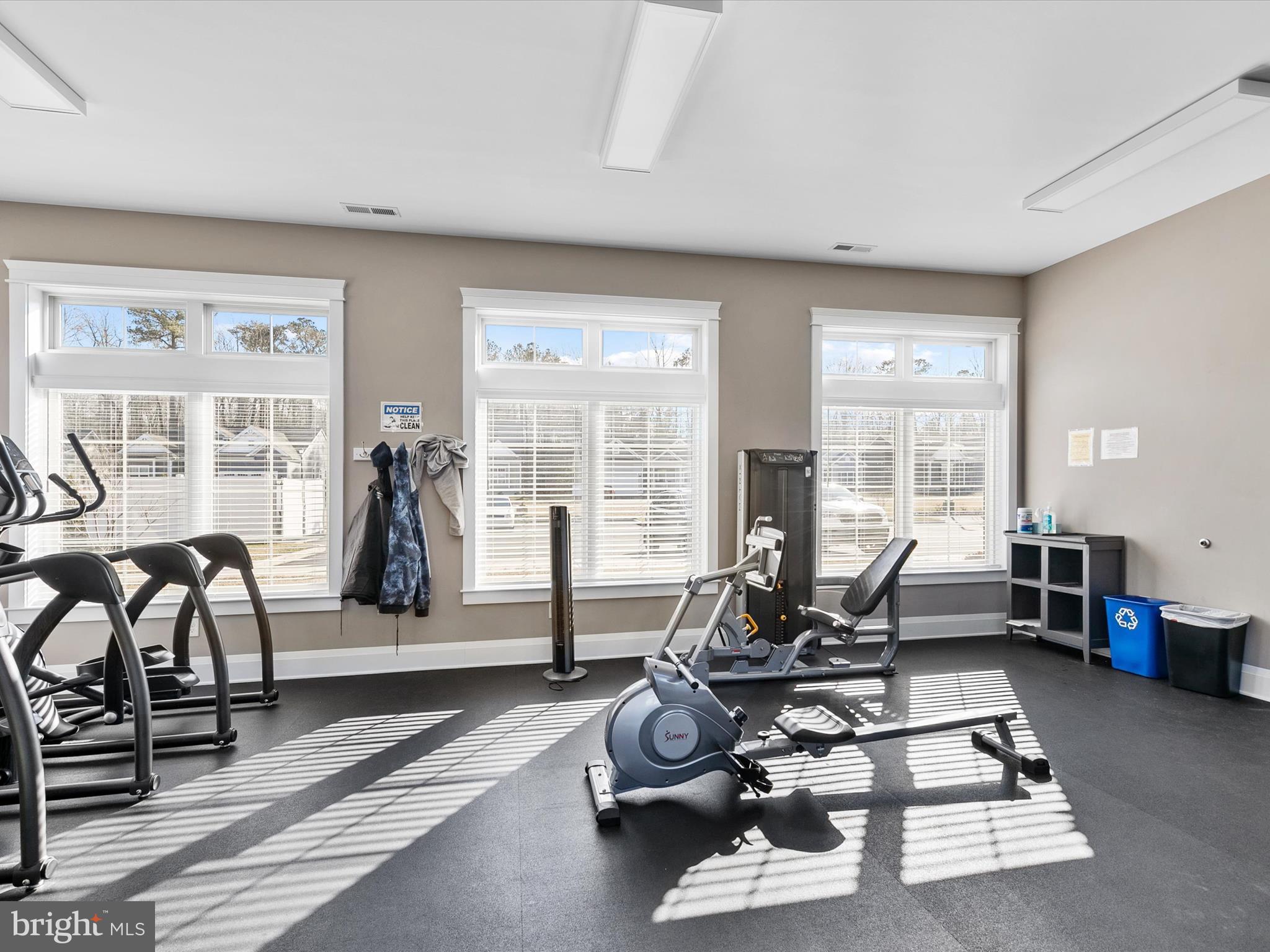 22657 Deep Woods Road Milton, DE 19968 - Photo 48 of 51 a living room with furniture a couch and large windows