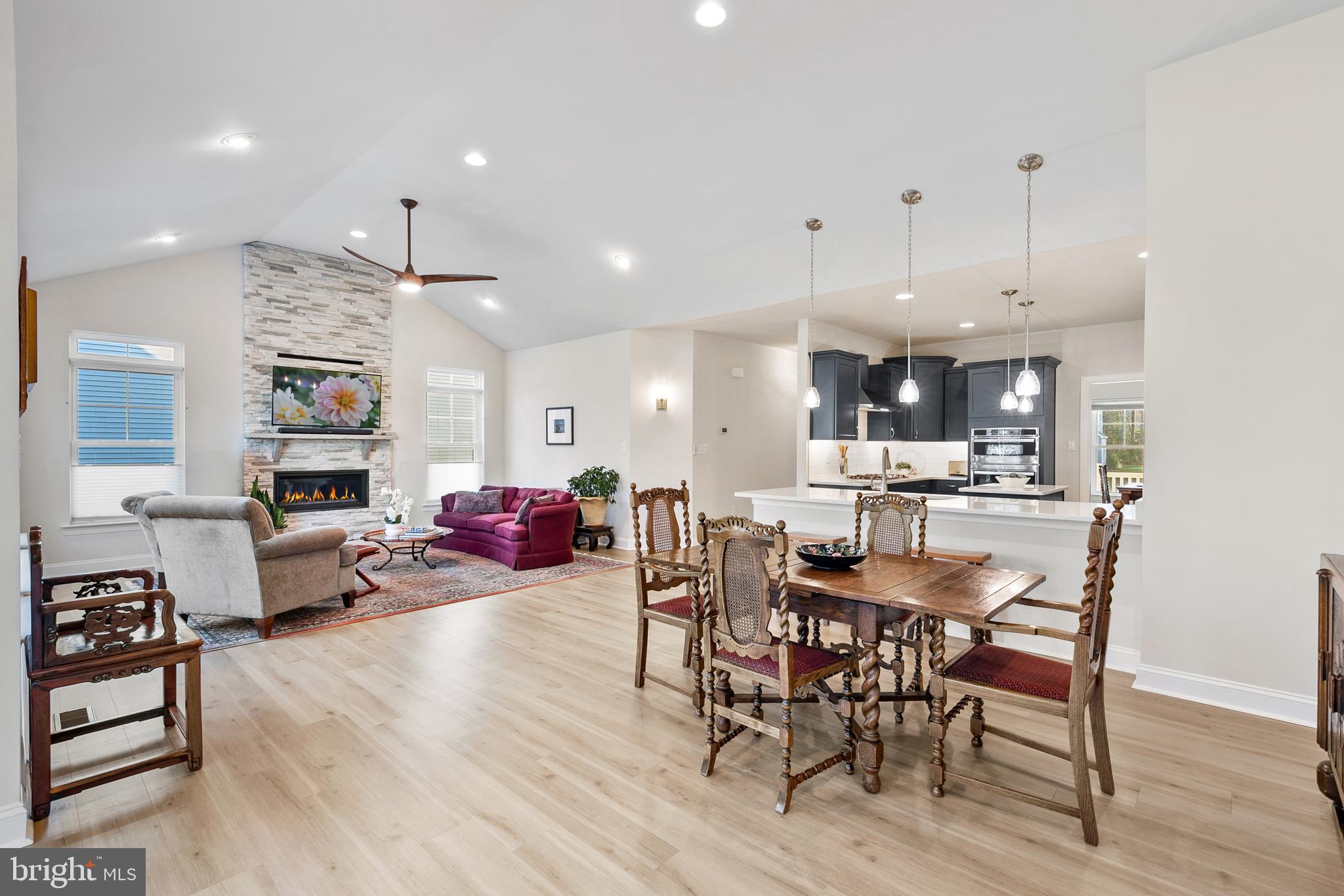 22657 Deep Woods Road Milton, DE 19968 - Photo 10 of 51 a view of a dining room with furniture and wooden floor