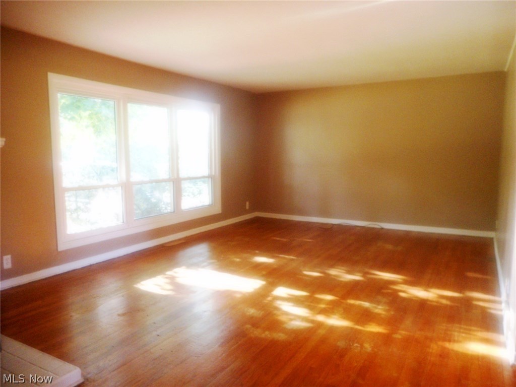 908 Jacoby Road Akron, OH 44321 - Photo 4 of 24 The living room is also freshly painted.